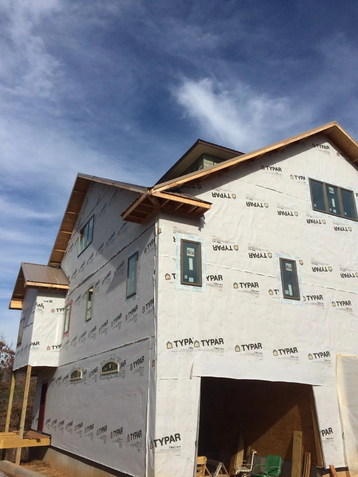 Stick built house wrapped in Typar with new roof framing and dormers in Sunol